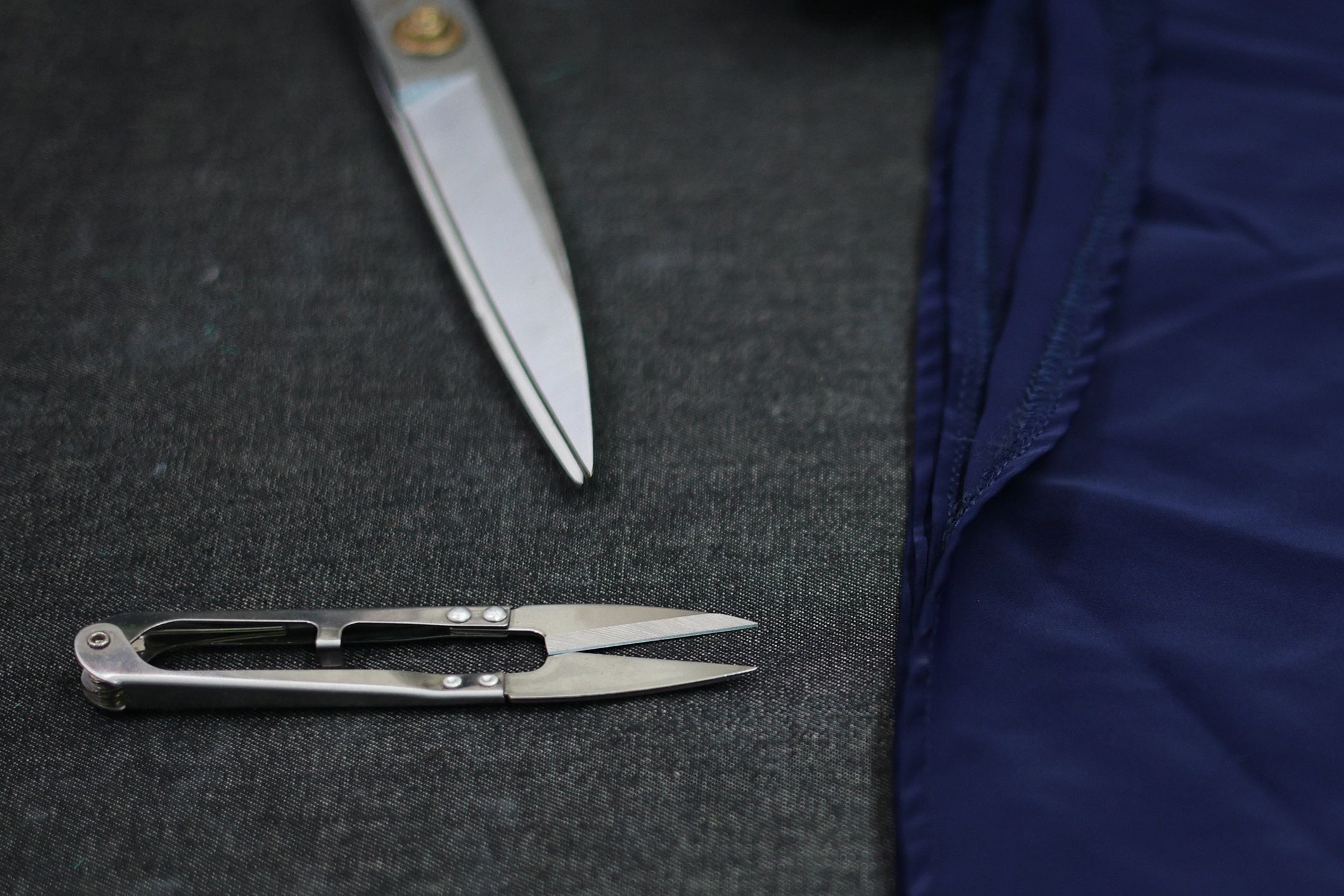 Tailor workstation with scissors and threads